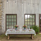 Table set outdoors under string lights. 
