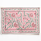 Decorative mat with floral patterns on a pink background