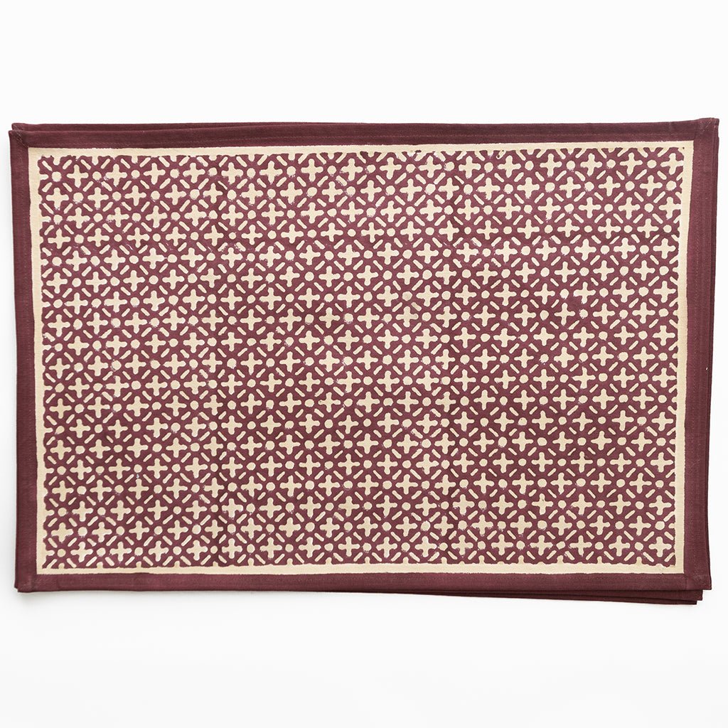 Patterned rug with geometric design on a white background