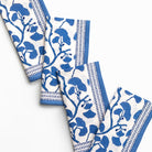 Set of blue and white patterned napkins on a white background