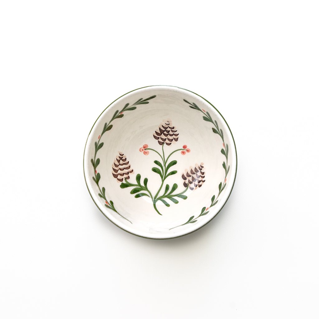 Decorative ceramic bowl with floral patterns on a white background