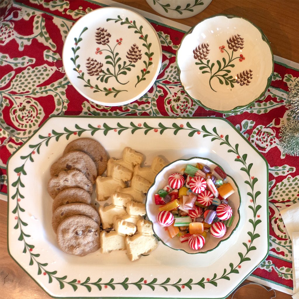 Decorative plate with cookies and candy on a patterned tablecloth