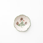 Decorative ceramic plate with floral design on a white background