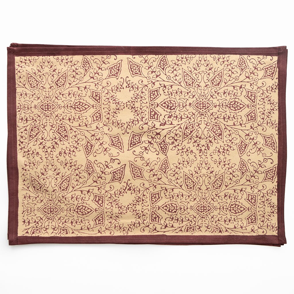 Decorative placemat with intricate pattern on a beige background