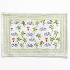 Decorative placemat with bicycle and palm tree pattern on a white background