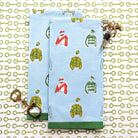 Two blue napkins with jockey silks pattern on a decorative background