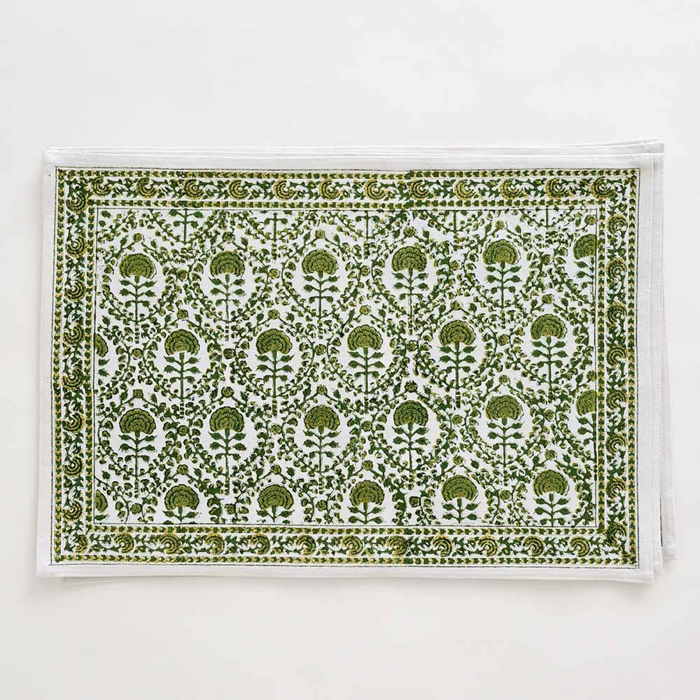 Earthy tones stem from this placemat that consists of green and white intricate details. 