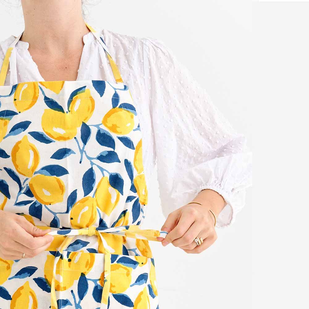 Block printed apron with adjustable neck length and tie around waist. 