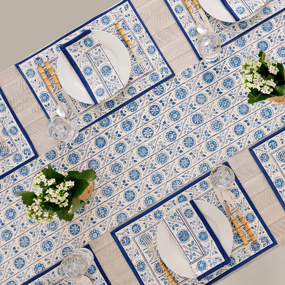Placemats paired with matching table runner and napkins. 