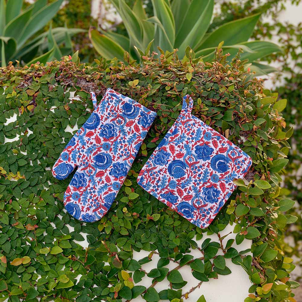 Oven mitt designed in blue and paprika orange as a hand block cotton print. 