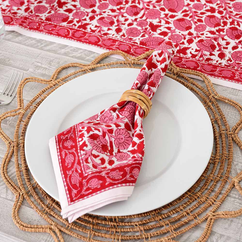 This floral printed pattern of rose, crimson, and bright pink colors, will spice up any table. 