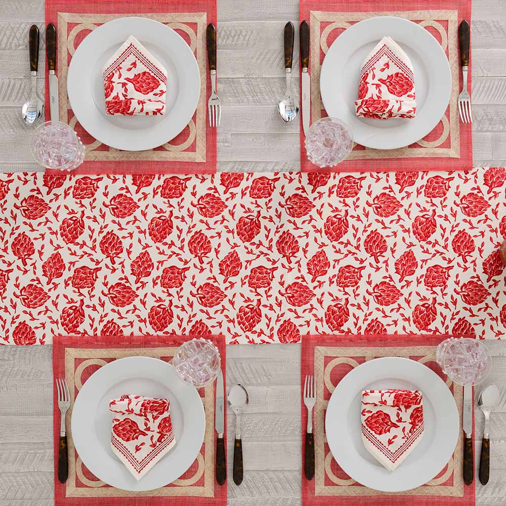 Dancing Artichokes red table runner paired with matching napkins. 