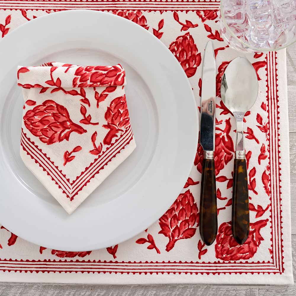 Placemat paired with matching napkin. 