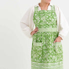 Pomegranate Green apron with pockets and adjustable ties. 