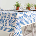 Close up of details on Pom Bells Wedgewood tablecloth. 