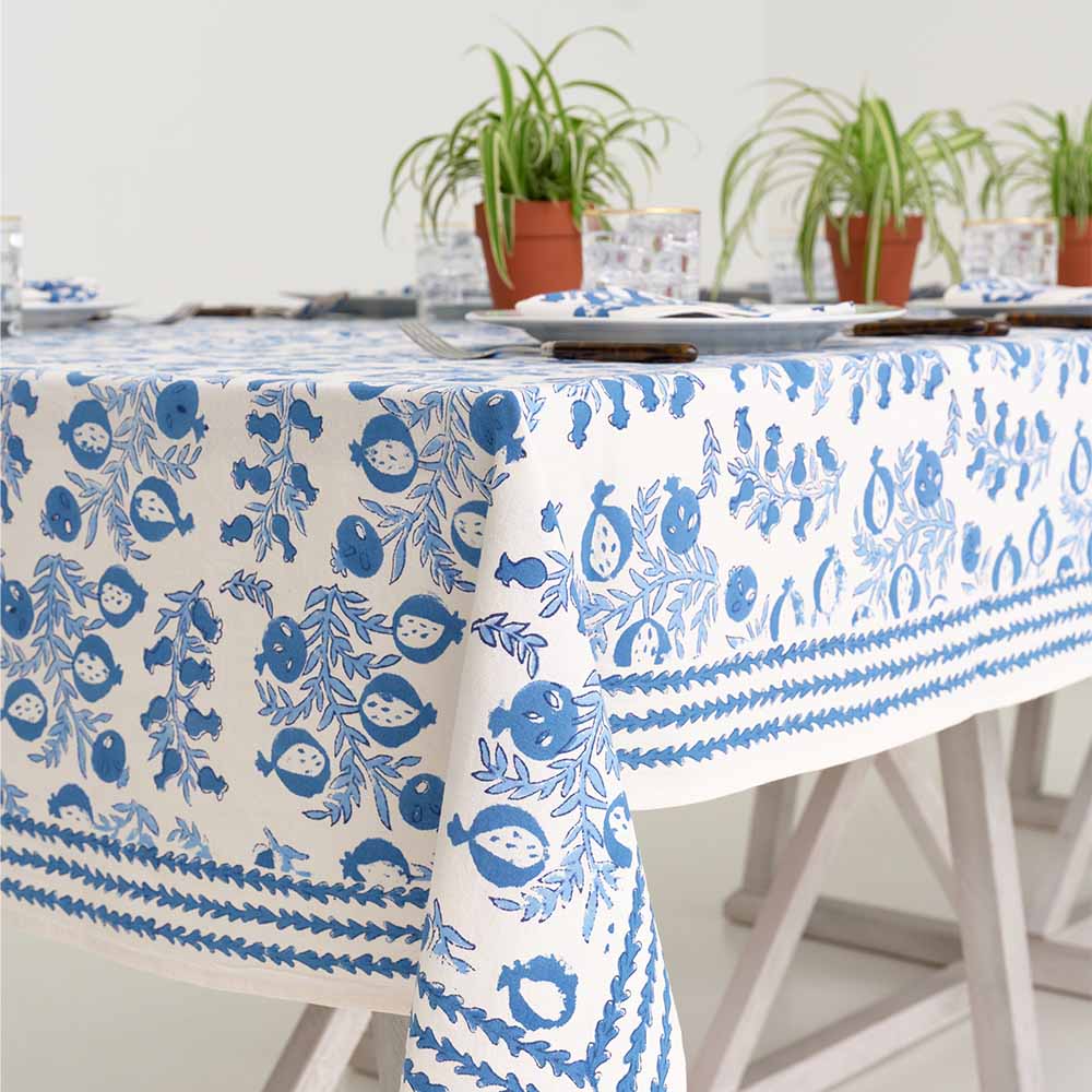Indoor table with Pom Bells Wedgewood tablecloth. 