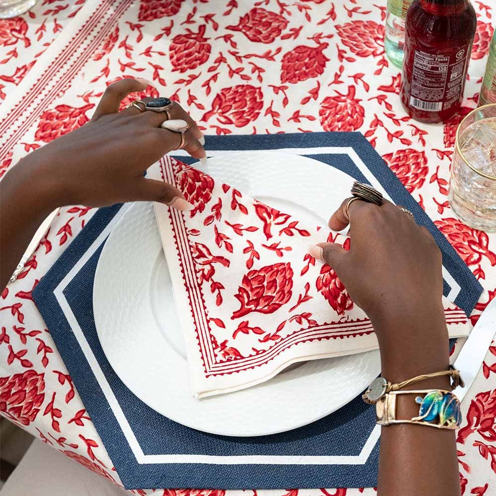 Close up shot of napkin on dinner table with matching tablecloth. 