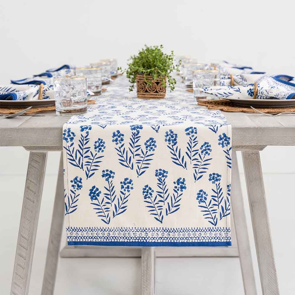 Table runner draped over side of table. 