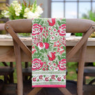 Autumn Orchard tea towel hanging on back of chair. 