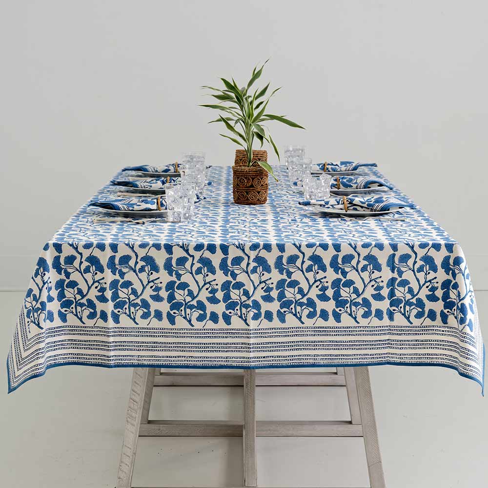 Overview shot of Ginkgo Blue tablecloth on dinner table. 