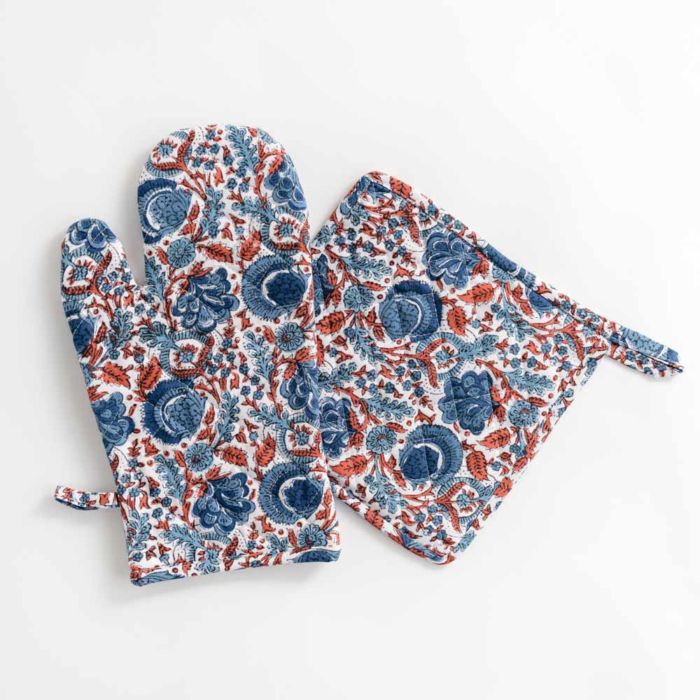 Oven mitt designed in blue and paprika orange as a hand block cotton print. 