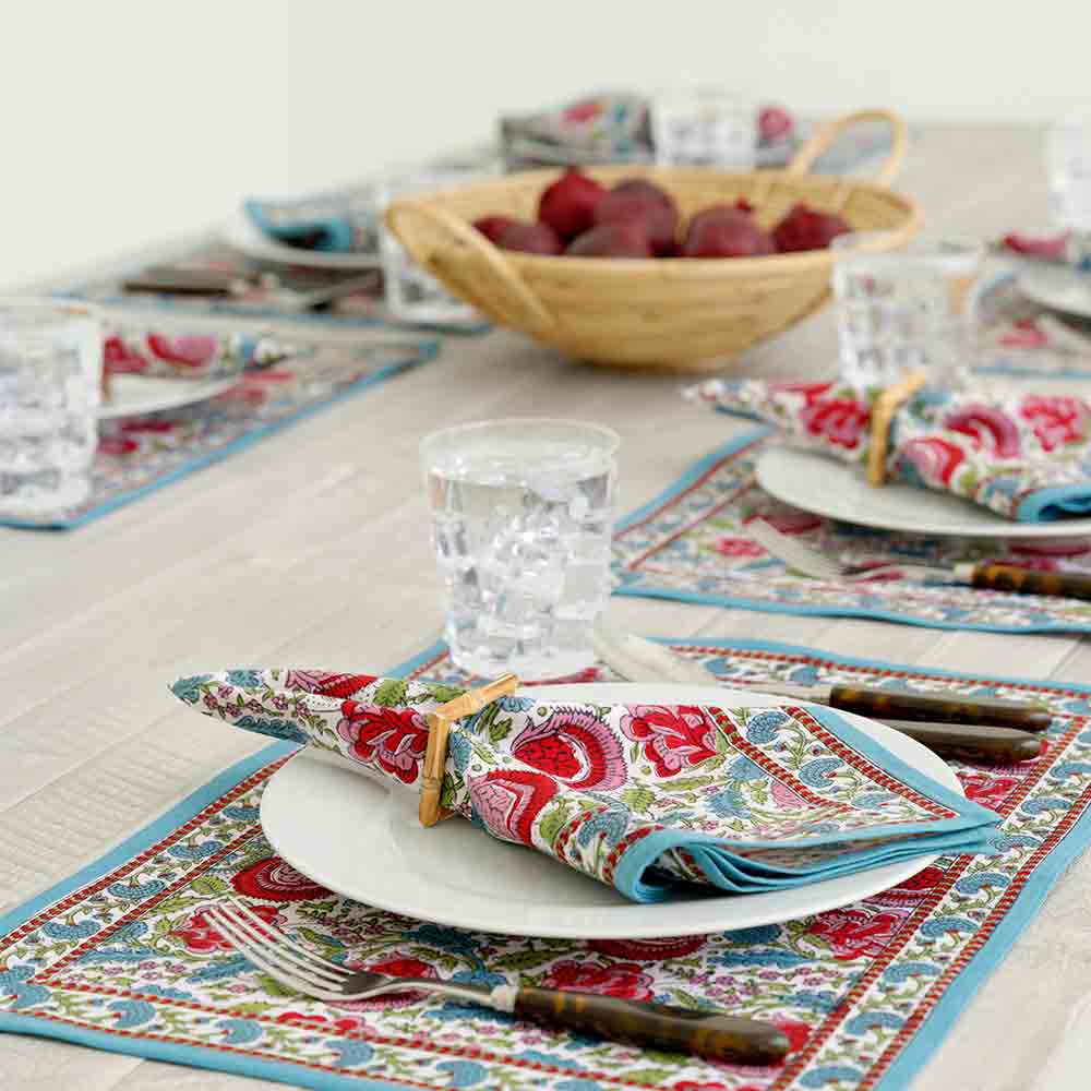 Colorful floral placemat with blue border outline. 
