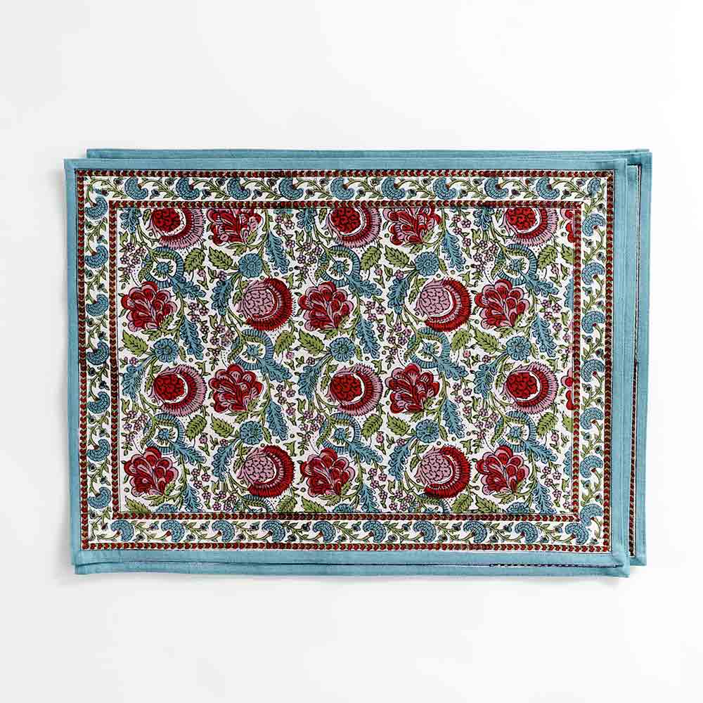 Colorful floral placemat with blue border outline. 