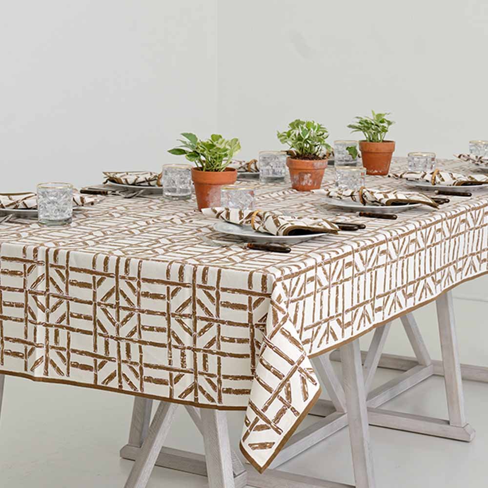 Natural brown and umber tones encompass this tablecloth with a geometric pattern. 