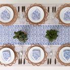 Table runner paired with matching napkins decorating dinner table. 