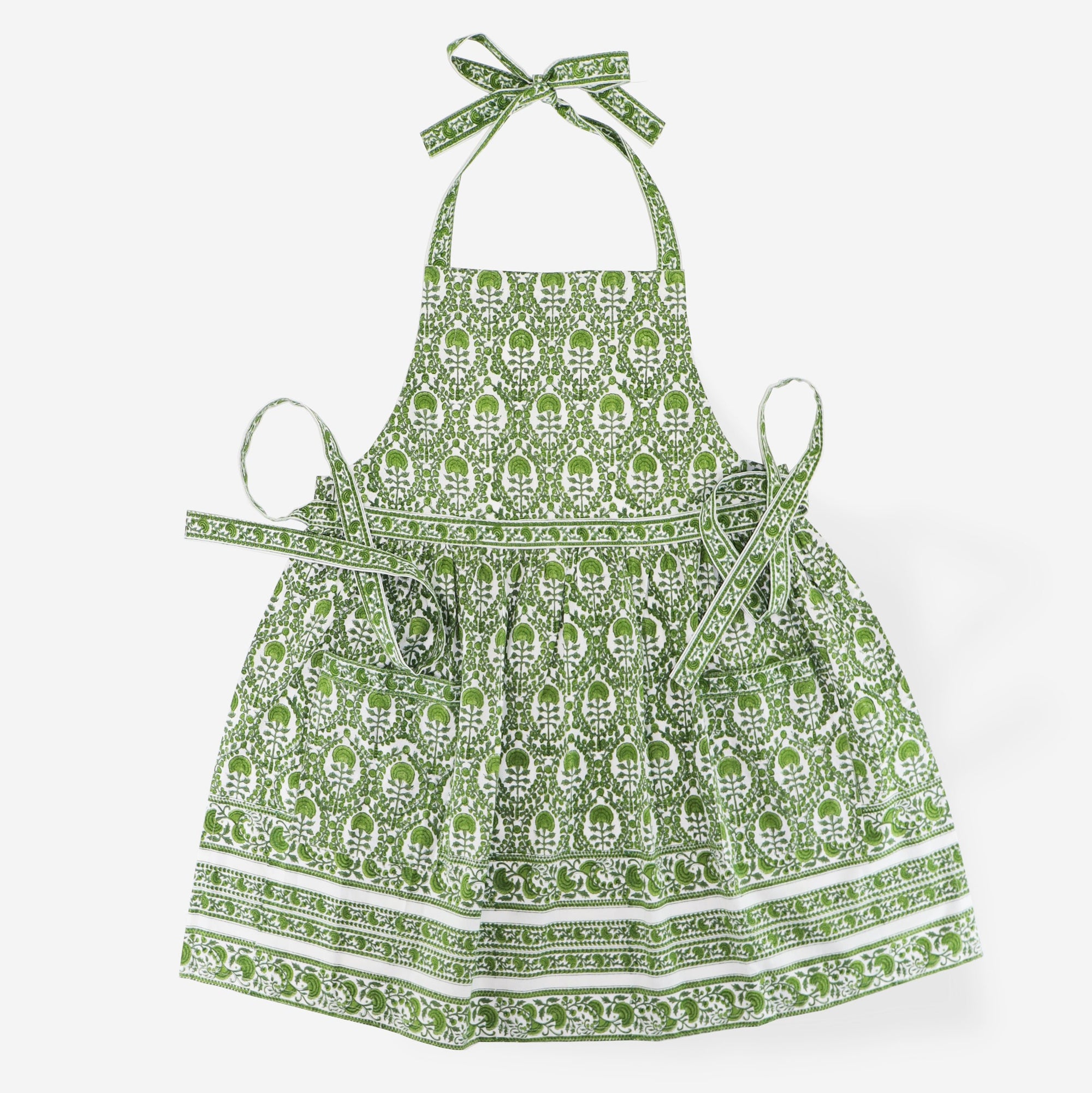 Caroline Green apron consisting of intricate green and white details. 