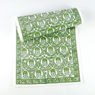 This 100% cotton table runner is a beautiful staple to have in your home and consists of rich and intricate green and white floral details. 