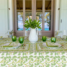 Spring Ginkgo Tablecloth with green dishes and plants. 