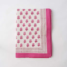 Rose floral quilt with hot pink border. 