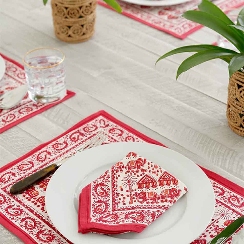 Placemat set of 4 with soft red hues and a unique repeat design. 