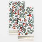 two tea towels with floral pattern in shades of sage green, crimson, marigold and deep orange on a white background