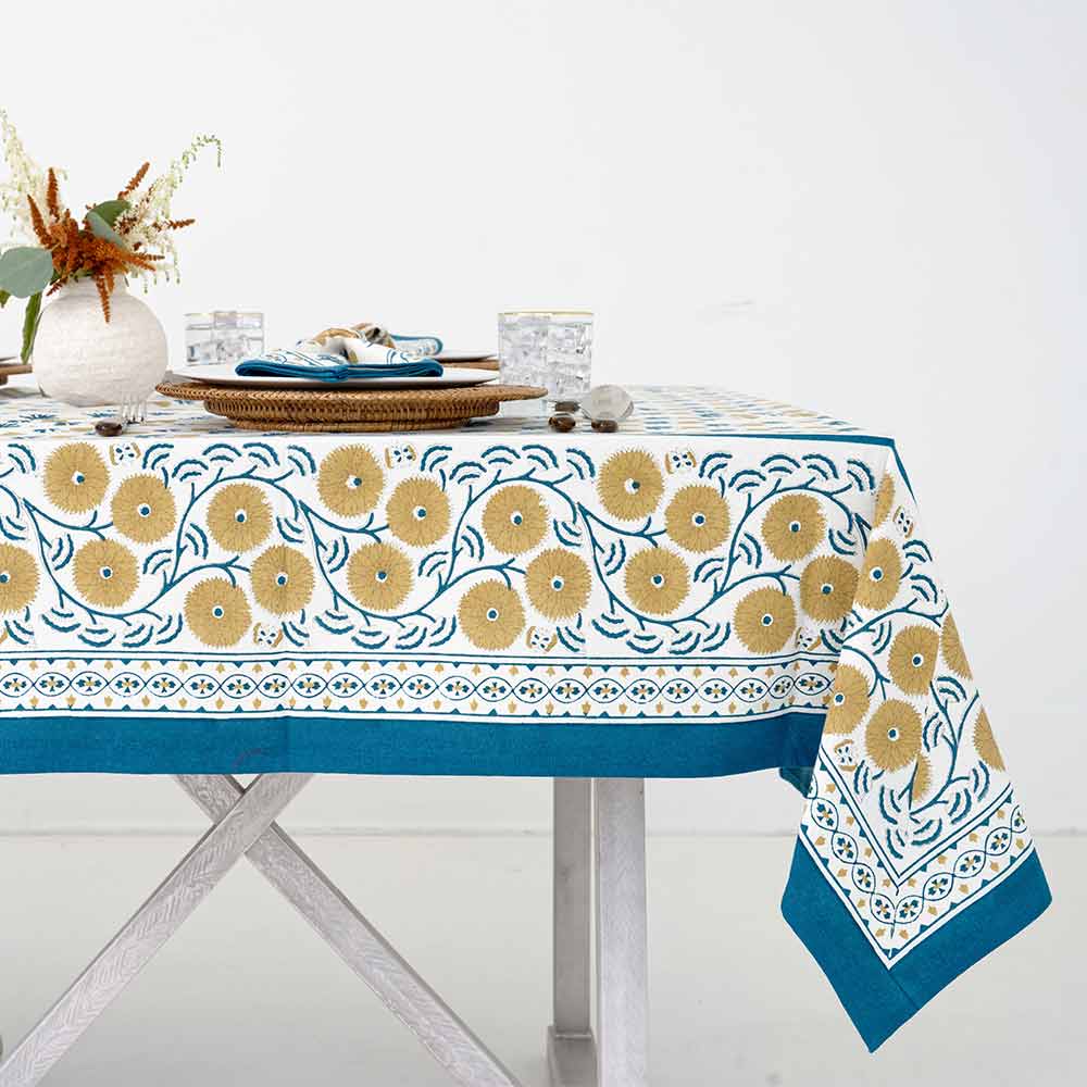 Details of gold florals on side of tablecloth. 
