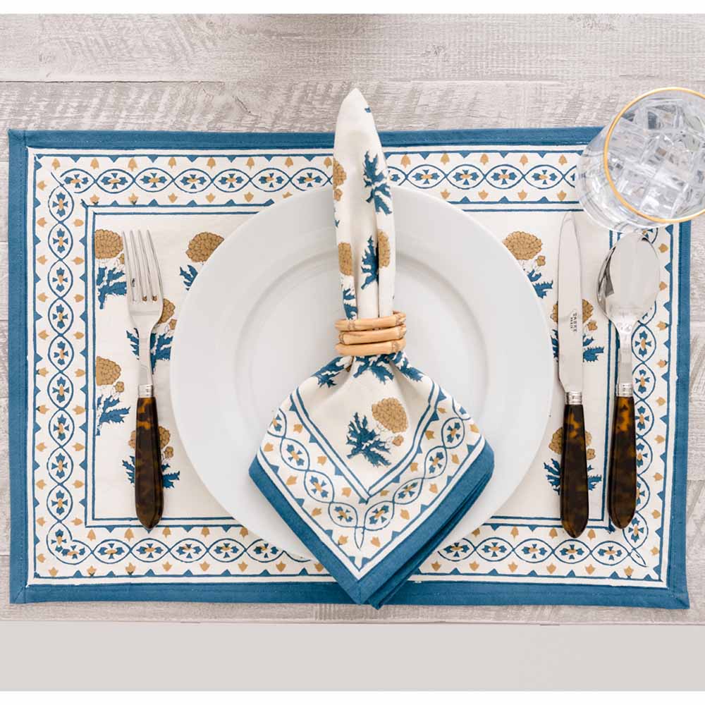 Placemat and matching napkin set on a dinner table. 