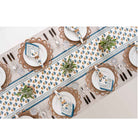 Overhead shot of dinner table with table runner and matching napkins. 