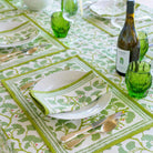 Spring Ginkgo Placemat on table with wine bottle and green glasses.