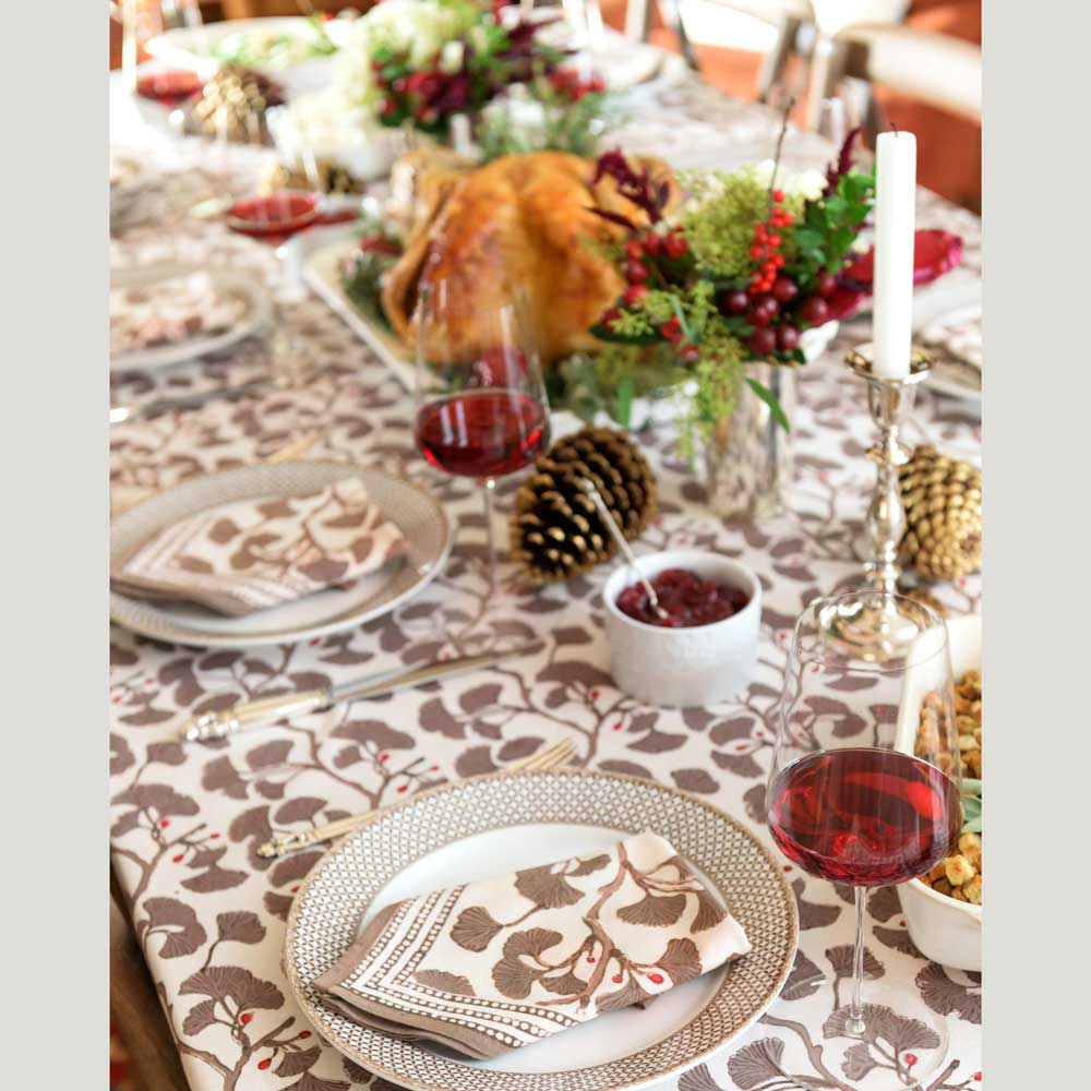 Holiday dinner showing tablecloth and napkin combo. 