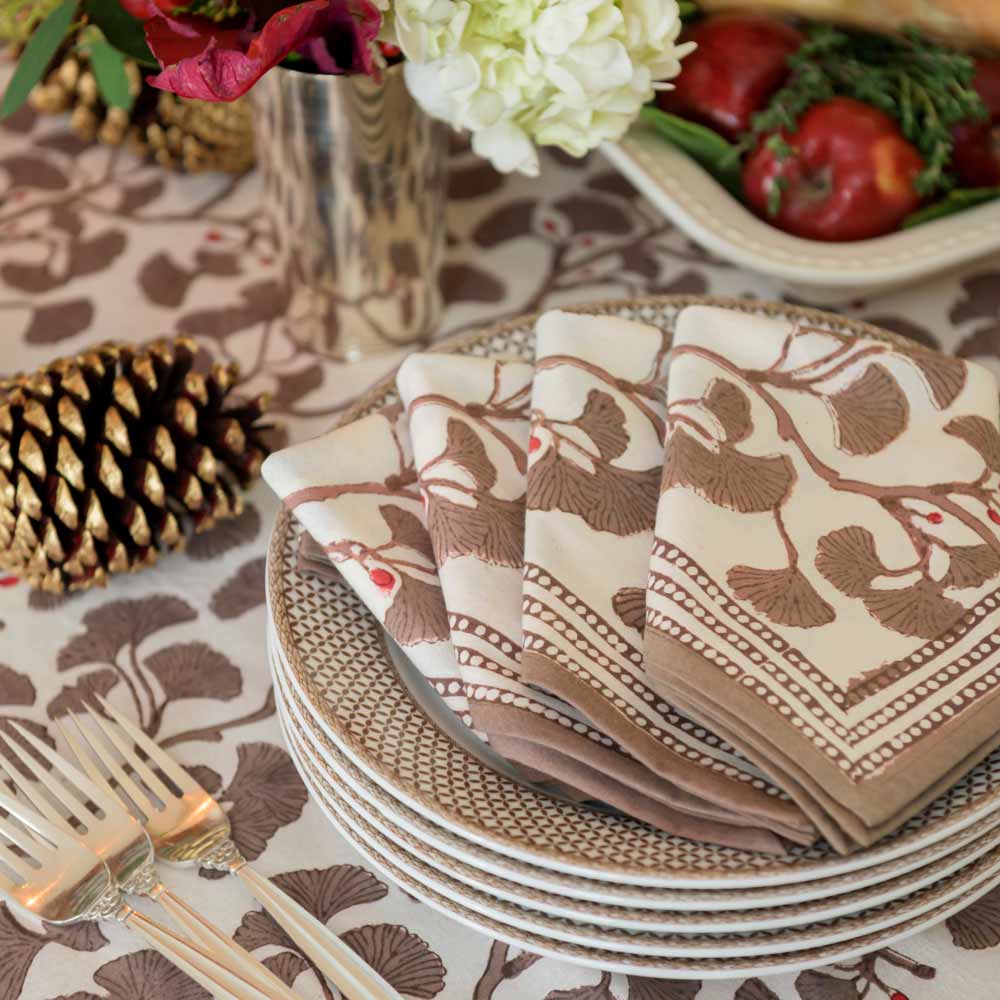 Ginkgo Taupe table runner draped over side of table. 