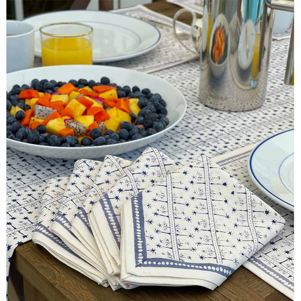 India Hicks Home Palm Avenue Cloud Tablecloth on wooden table