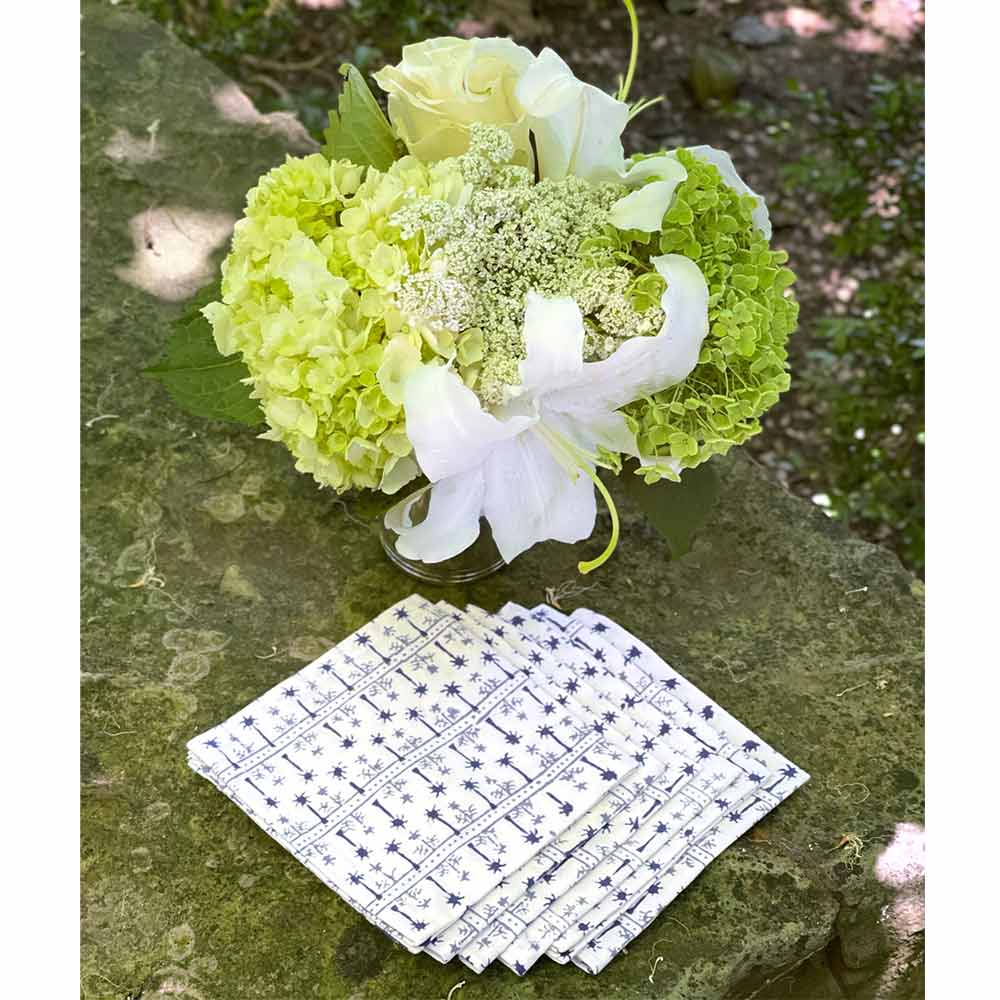 India Hicks Home Palm Avenue Cloud napkins with floral bouquet