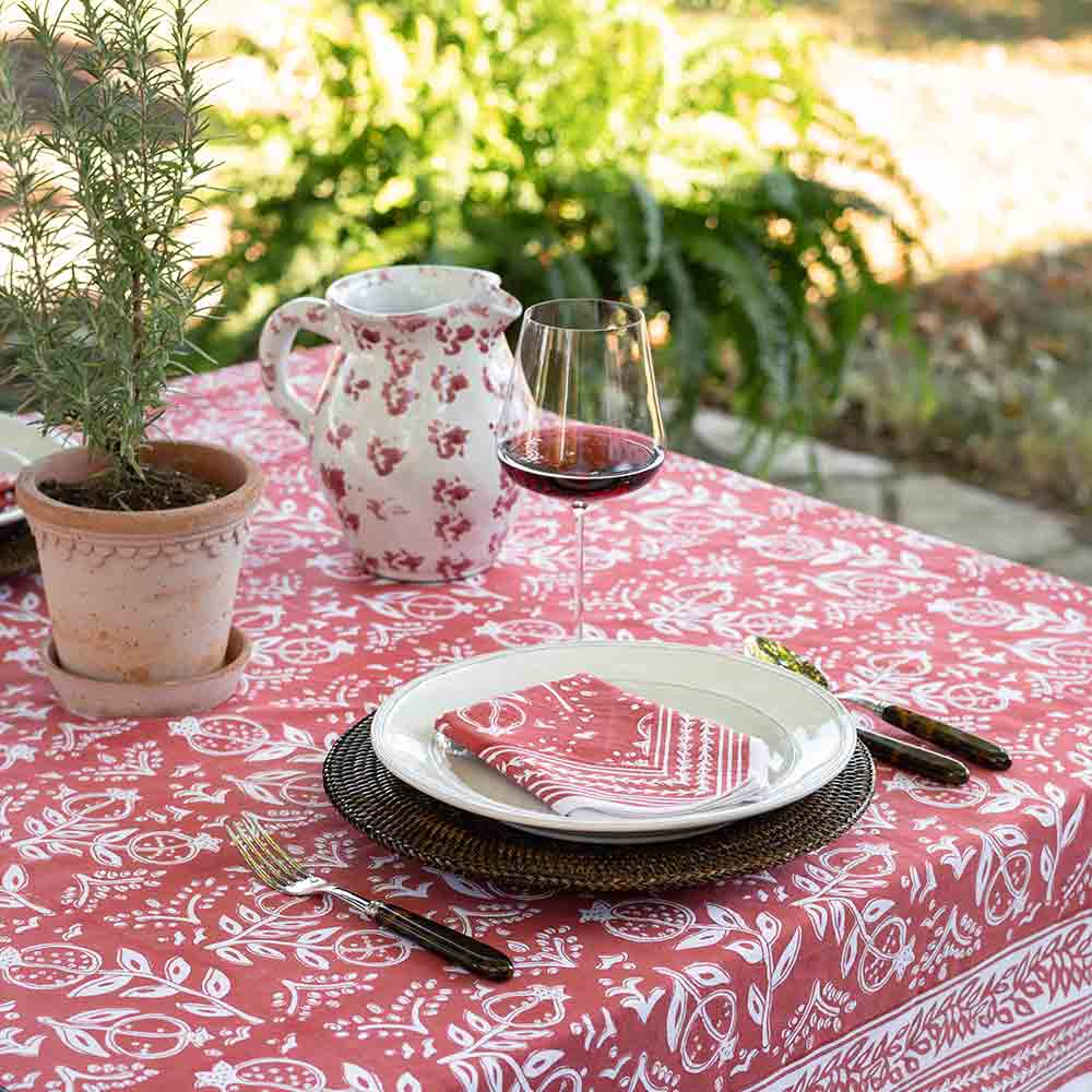 Pomegranate Poppy tablecloth and matching napkin complimented with red wine. 