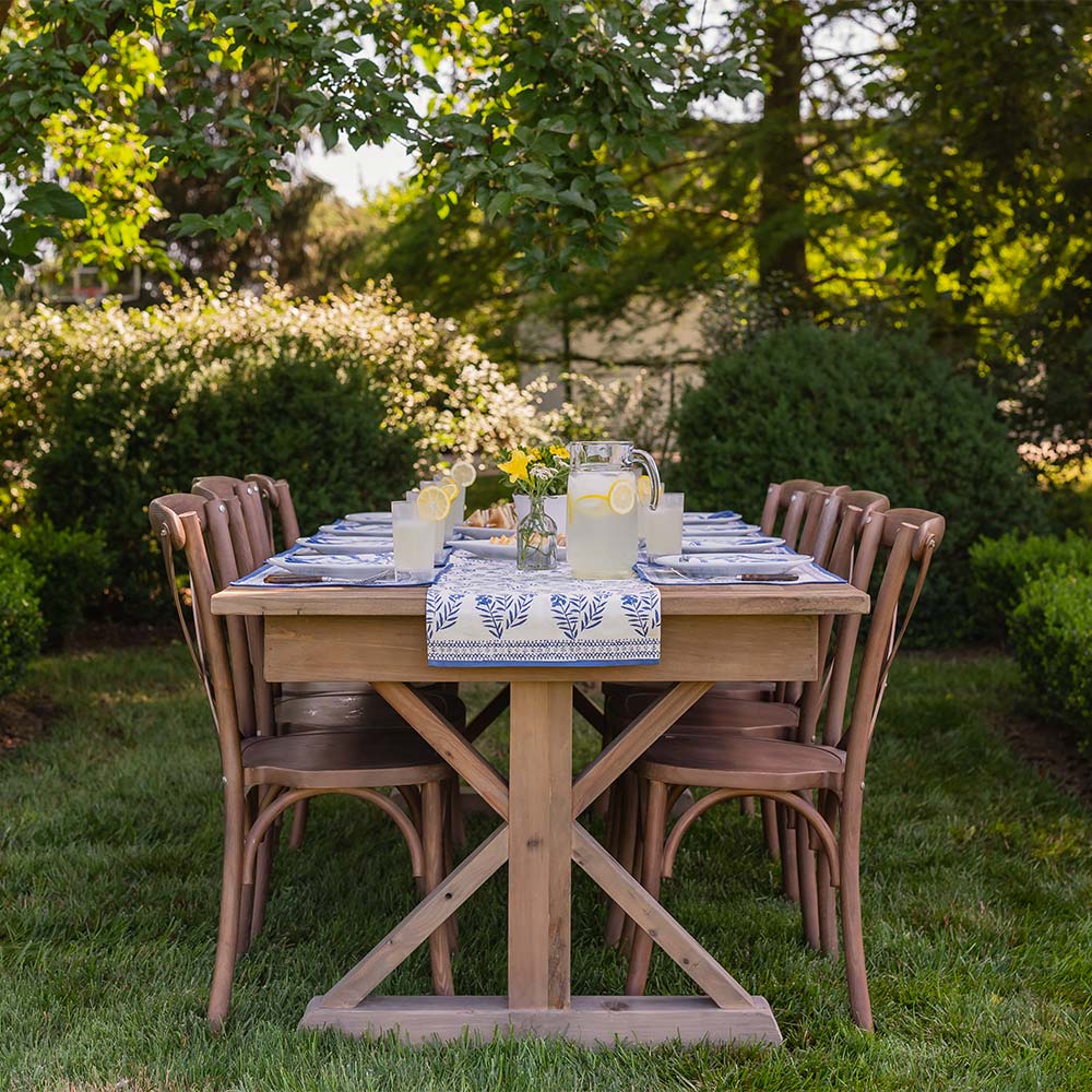 Outdoor dinner table with Phlox Blue table runner. 