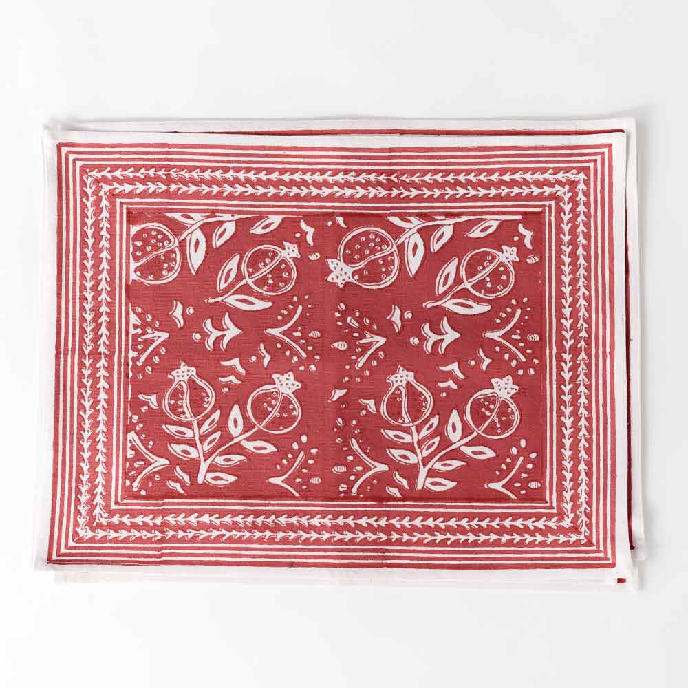 Close up of Pomegranate Poppy Placemat showing red and white detailing. 
