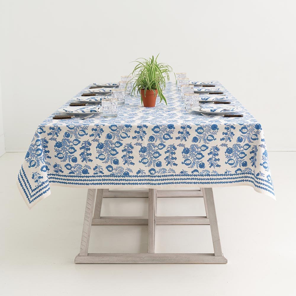 Indoor table with Pom Bells Wedgewood tablecloth. 