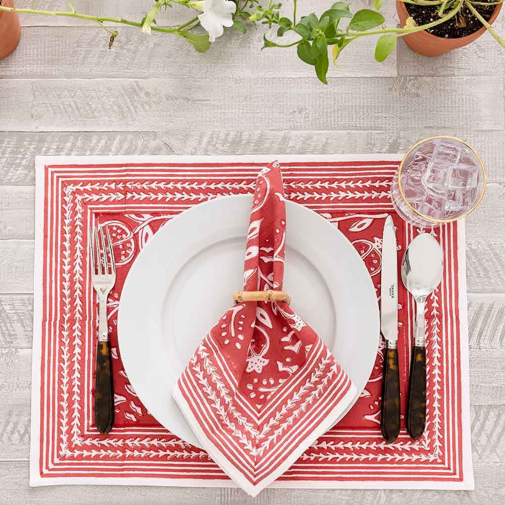 Close up of Pomegranate Poppy Placemat showing red and white detailing. 