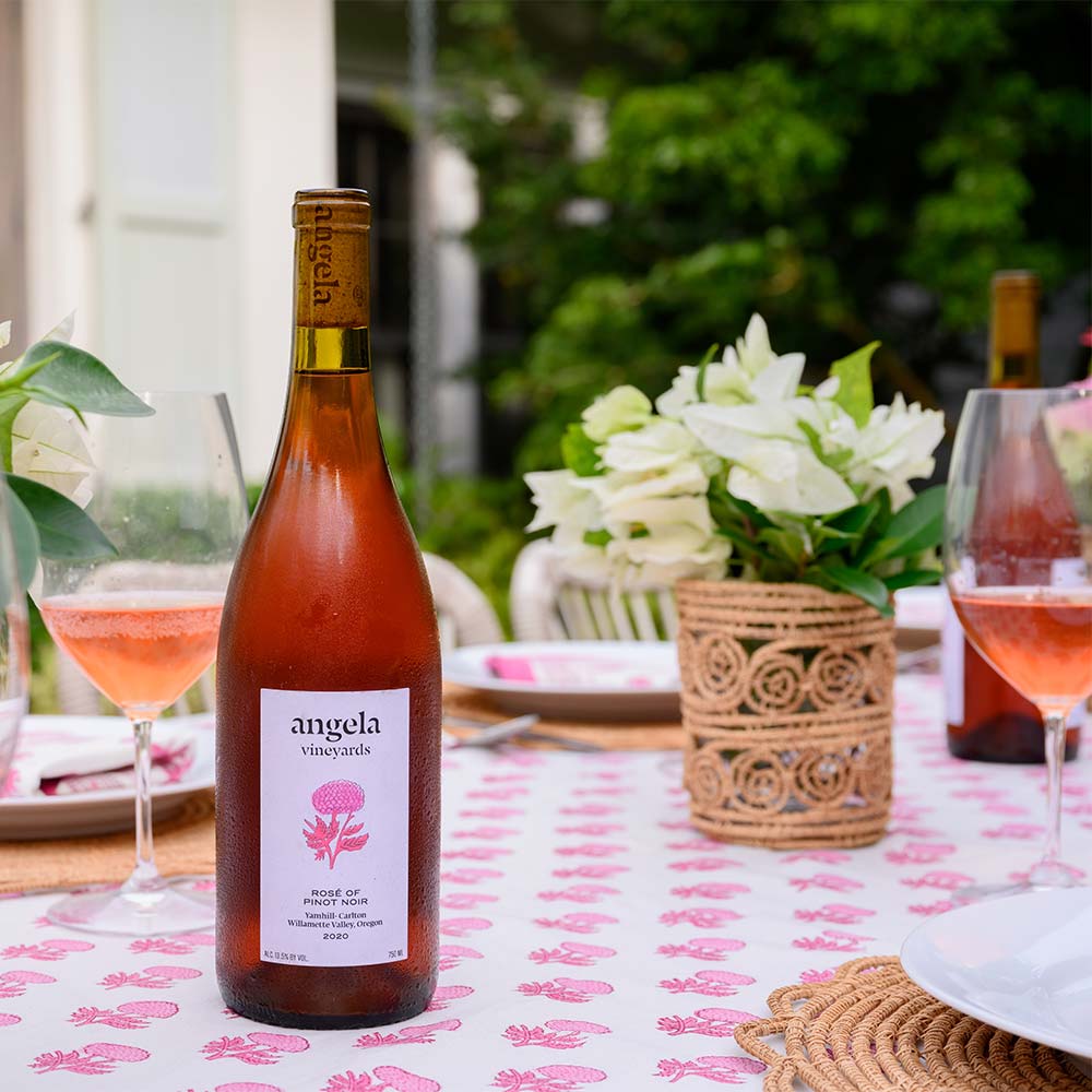 Rosé wine paired with rosé tablecloth. 