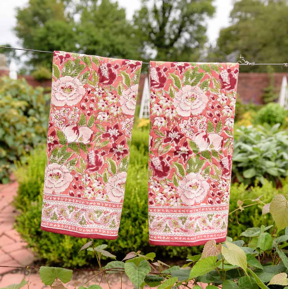 Spice Route Garnet Red Tea Towels hanging on line.
